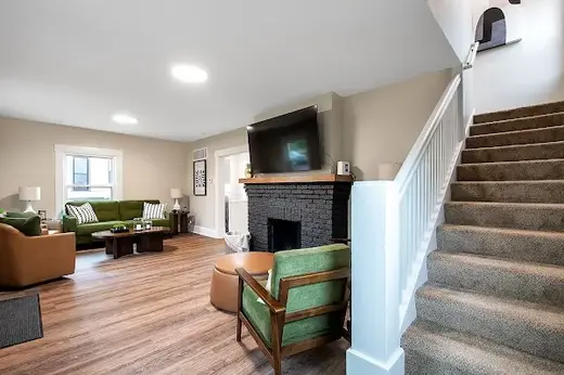 Bright living room with comfortable seating at How It Works Sober Living - Waco House, a sober living home in Kansas.